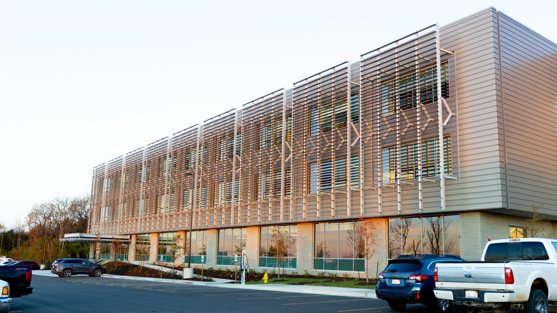 A modern building's exterior from the parking lot at the KU Innovation Park in Lawrence.