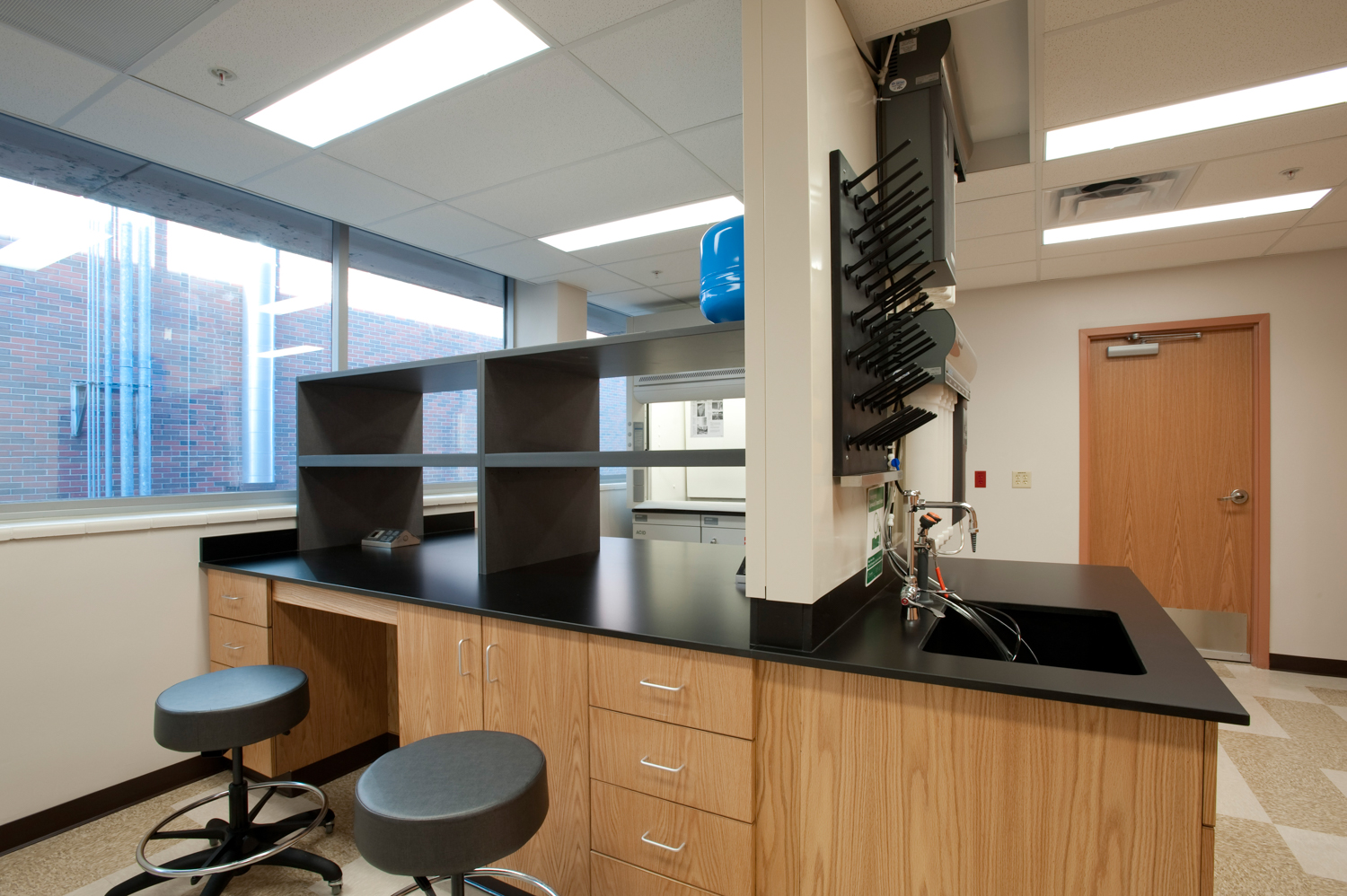 An empty lab room with black stools at the KU Innovation Park in Kansas City.